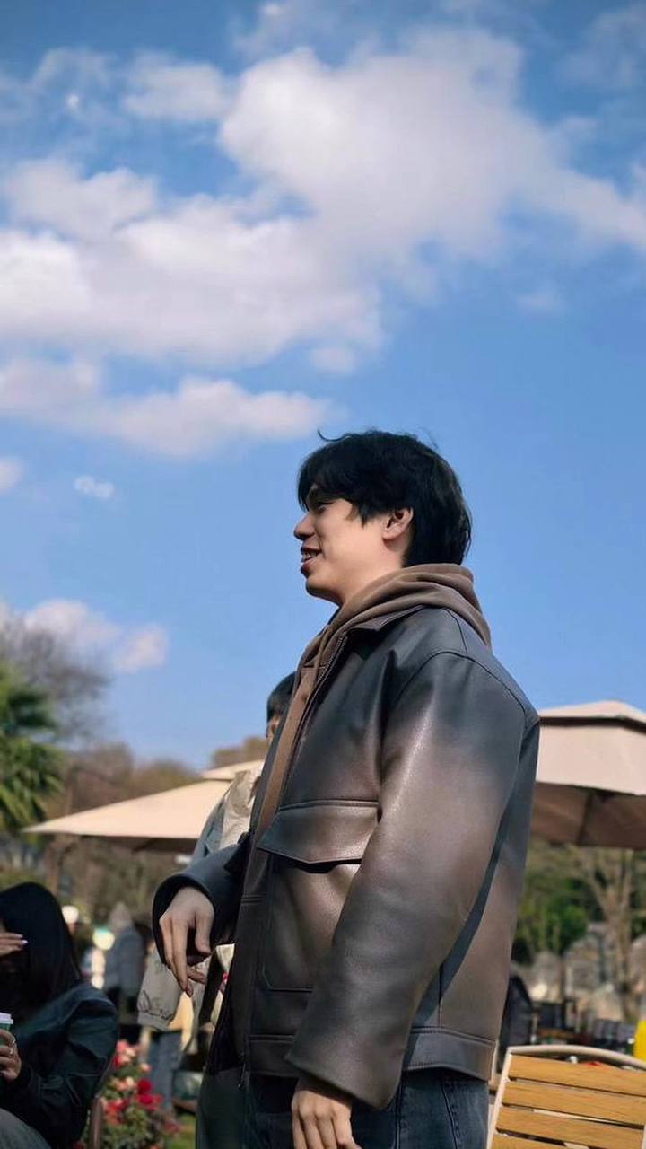 Ryan in a leather jacket outdoors